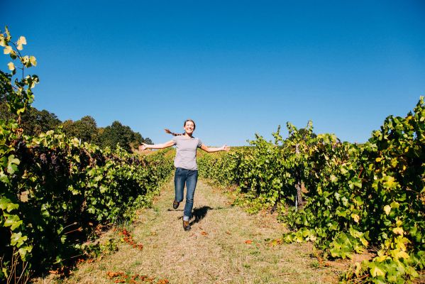 General Manager, Jenny Burger, runs through the vineyard